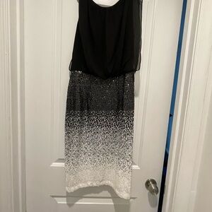 Super cute black and white dress- drapey top and fitted sequined skirt.